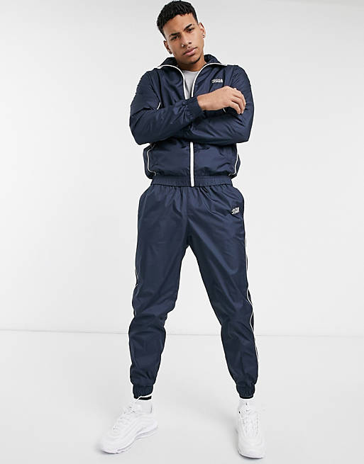 Tracksuits Jack & Jones Intelligence tracksuit with zip through jacket in navy 