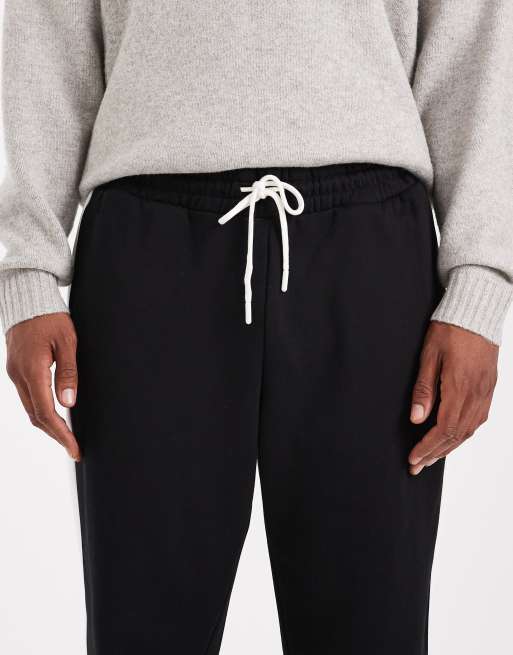 Jack & Jones – Locker geschnittene Trainingshose in Schwarz mit Seitenstreifen, 5 von 5