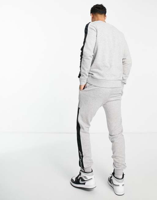 Grey nike tracksuit with best sale white stripe