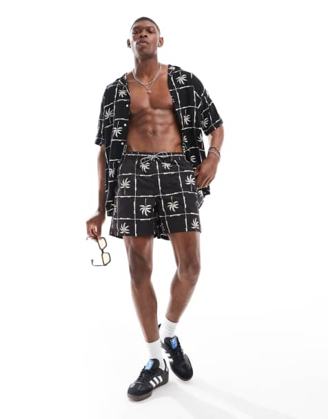 Jack & Jones - Pantaloncini da bagno neri con stampa a griglia con palme in coordinato - view 1
