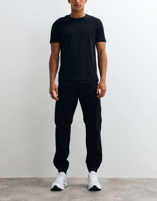 Jack & Jones - Pantalones cargo negros de corte slim con bajos ajustados, 2 de 5