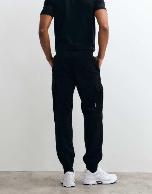 Jack & Jones - Pantalones cargo negros de corte slim con bajos ajustados, 4 de 5