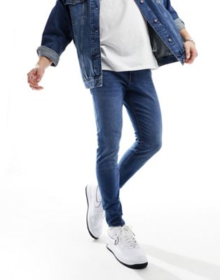Jack & Jones pete tapered jeans in mid blue - ASOS Price Checker