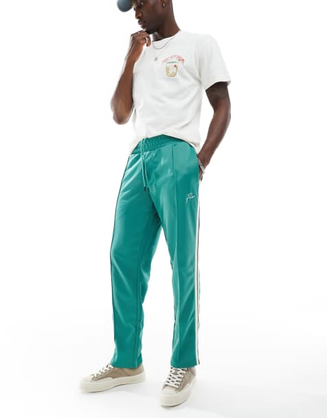 Jack & Jones Premium tracksuit bottoms in green with stripe - view 1