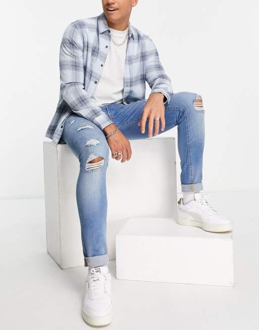 Jack & Jones - Skinny fit jeans met scheuren in middenblauw