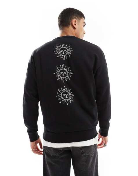Jack & Jones - Sweat-shirt ras de cou à épaules tombantes avec imprimé soleils au dos - Noir - view 1