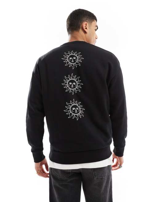 Jack & Jones - Sweater met verlaagde schouders, ronde hals en zonnenprint op de achterkant in zwart 