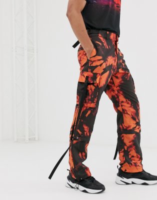 orange top black pants