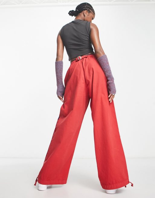 Jaded London low rise parachute trousers with flocking in red