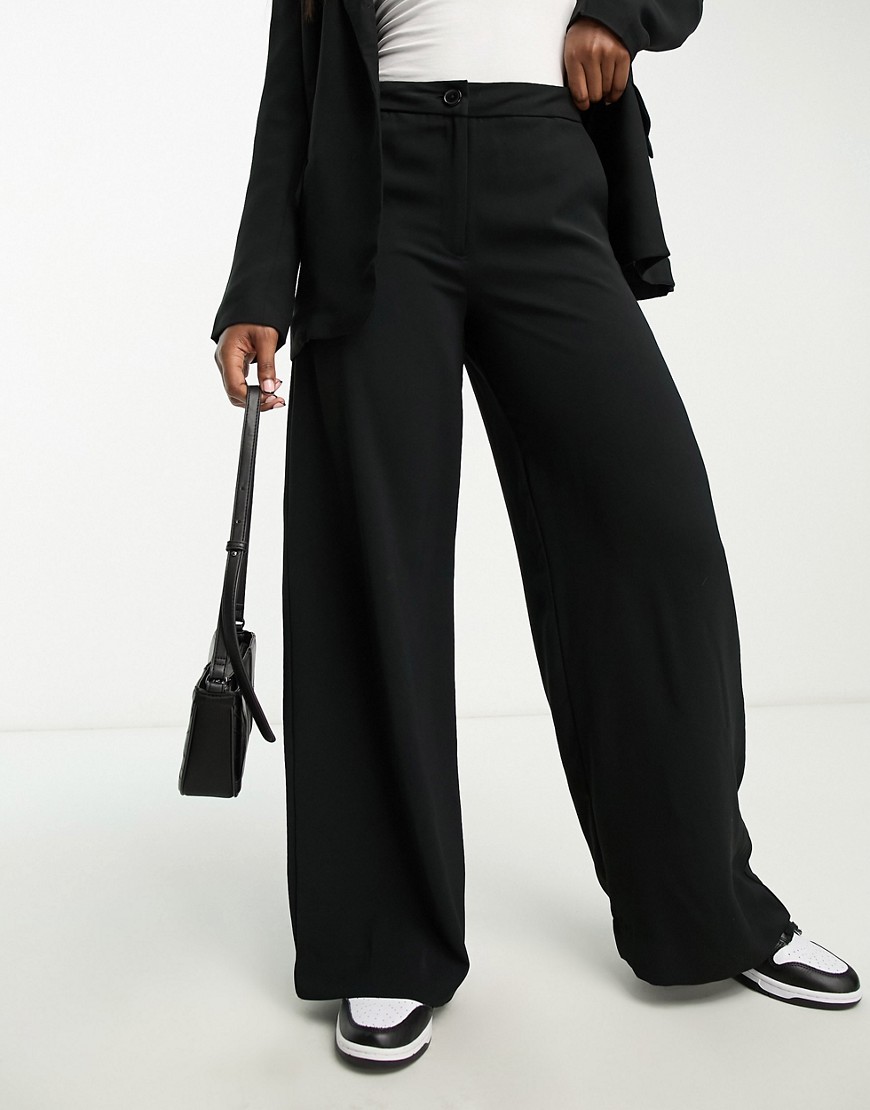 high waisted wide leg pants in black - part of a set