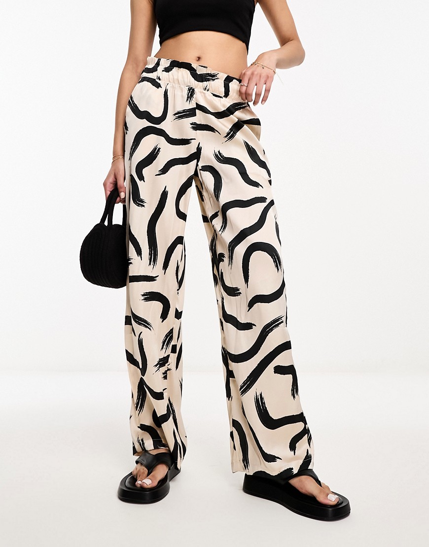 JDY high waisted wide leg satin trousers in cream graphic print-White