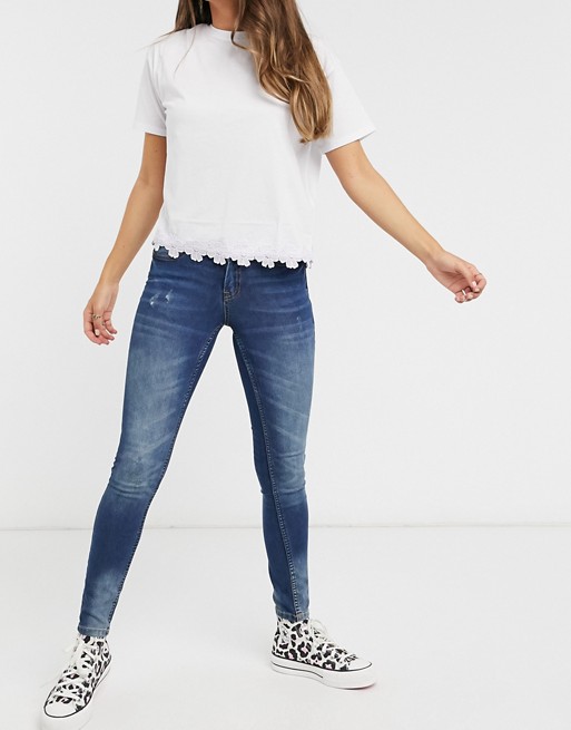 JDY super skinny high rise jeans with distressed washing in mid blue