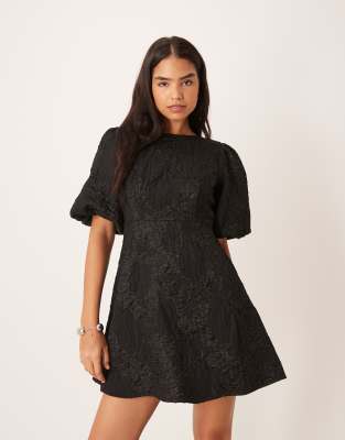 Robe courte en jacquard à manches bouffantes et nauds dans le dos - Noir S