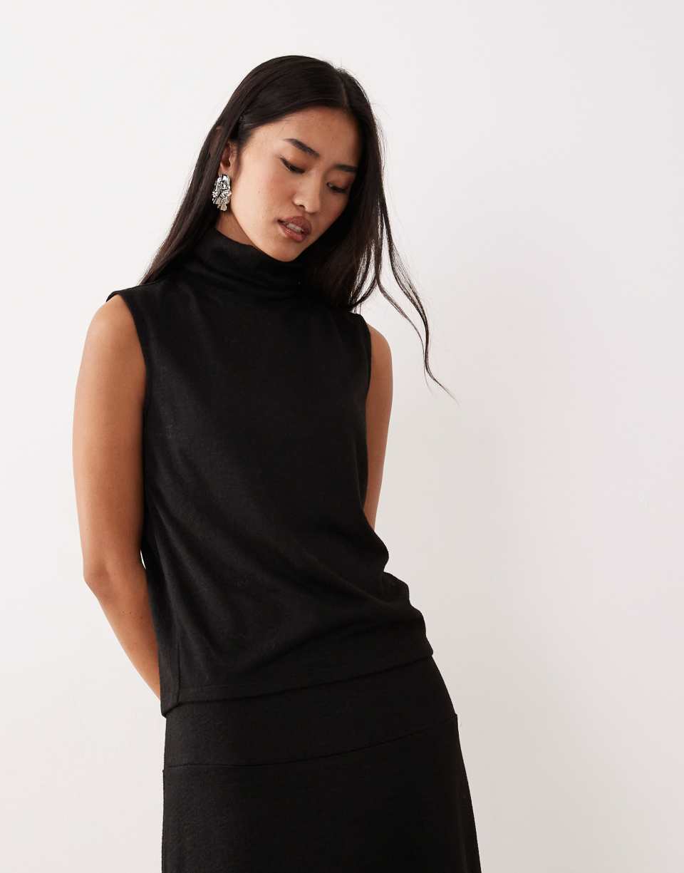 Black sleeveless roll-neck top