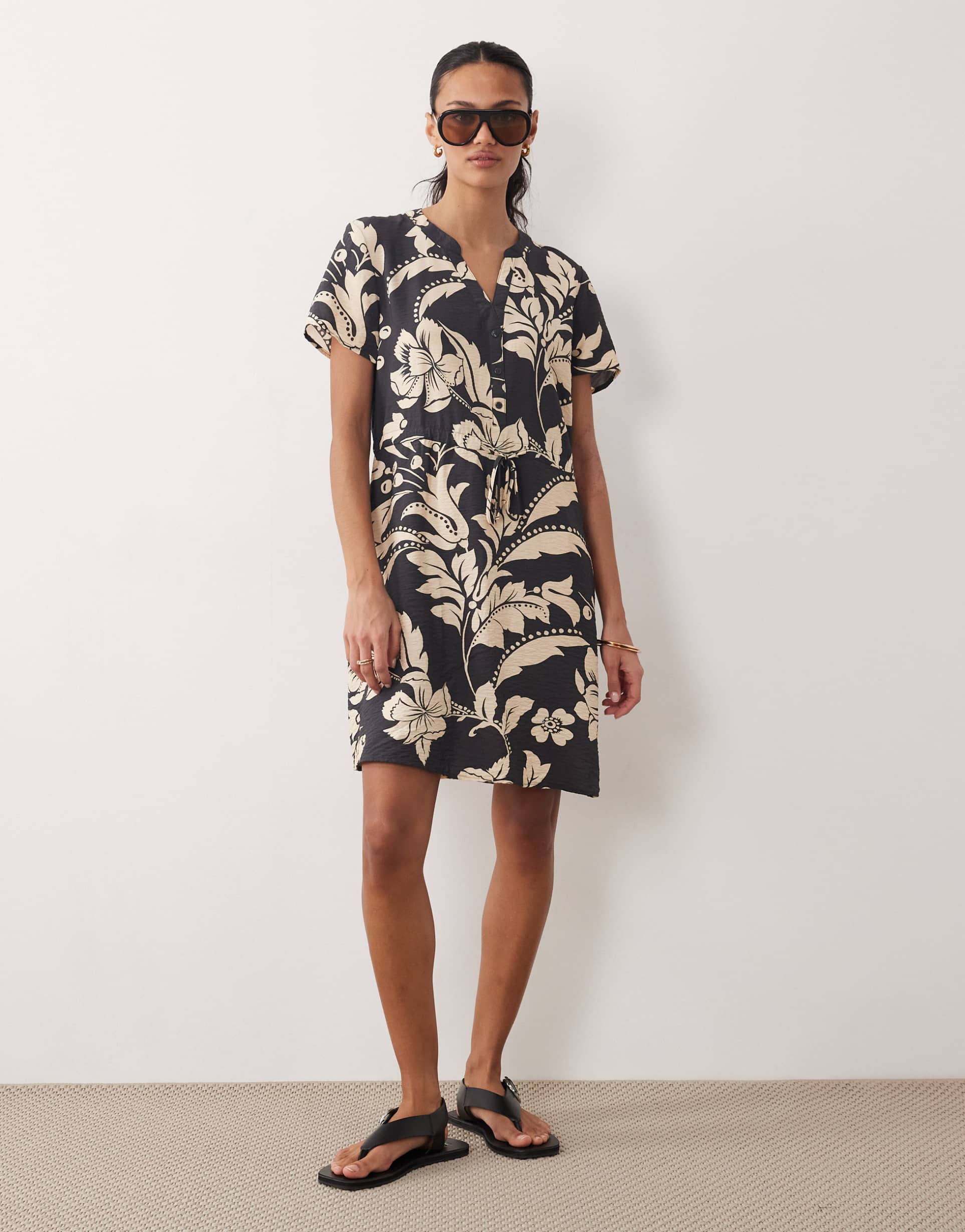 jdy v-neck tie waist mini dress in black with cream floral print