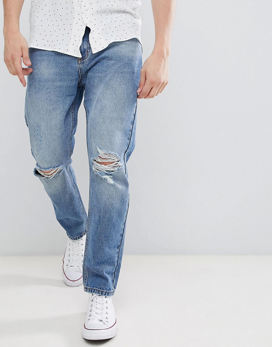 Jeans med oprullet kant og slidte knæ i original stonewash fra Rollas-Blå
