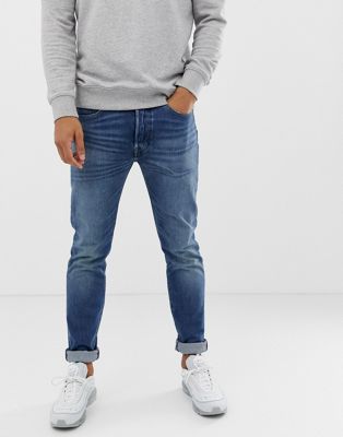 Jeans med smal pasform og standard taljehøjde i 'bubbles street' mellemvask fra Levi's 501-Blå
