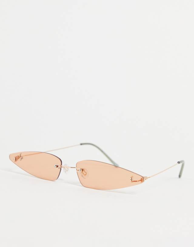 Jeepers Peepers extreme cat eye sunglasses with silver frames and pale orange lens