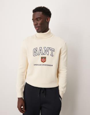 Jersey color crema con cuello subido y logo universitario de punto de GANT - view 1