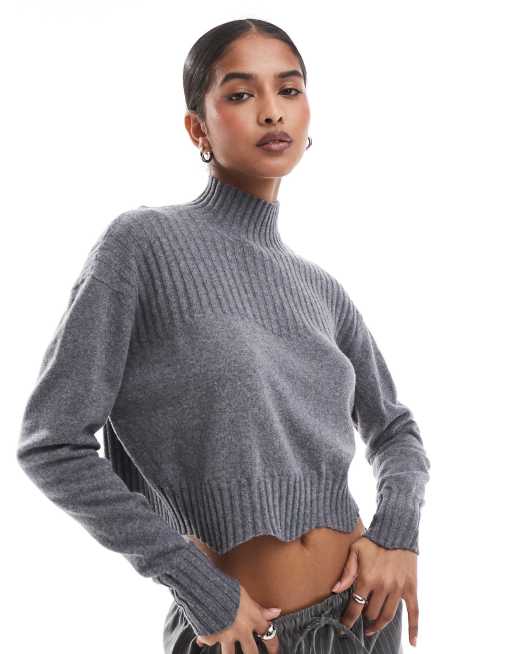 Jersey gris melange con cuello subido y bordes festoneados Joy de Scalpers