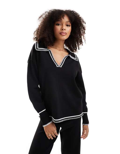 Jersey negro con cuello de solapas y pespuntes blancos de punto de SNDYS (parte de un conjunto)