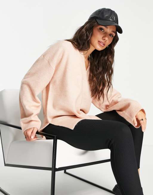 Jersey rosa pálido con cuello de pico pronunciado y acabado suave de M Lounge