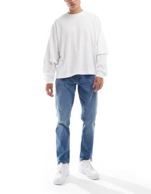 adam tapered jeans in mid blue wash