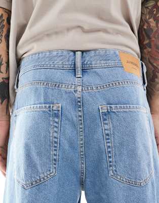 JJ Rebel baggy fit jeans in mid wash blue 