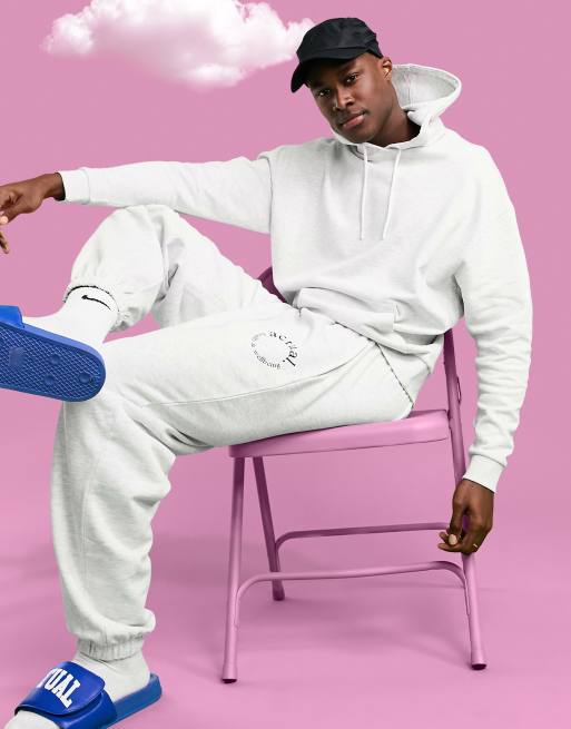 Jogger blanco jaspeado extragrande con estampado 