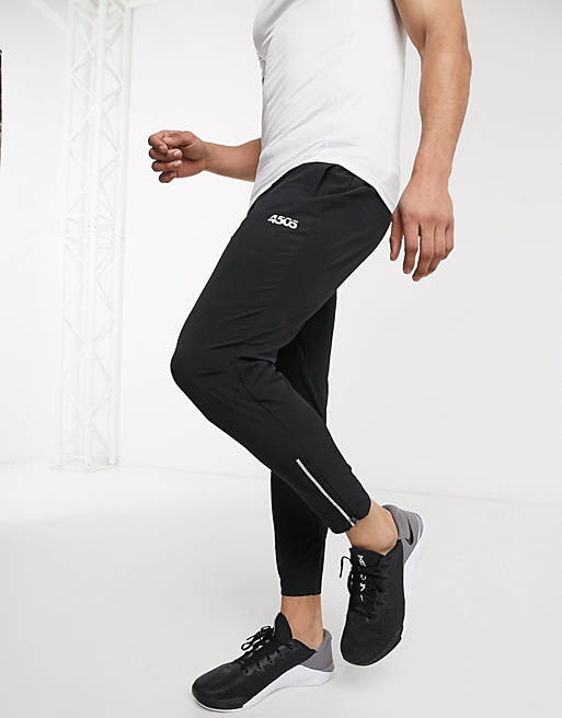 Joggers ajustados de corte tapered para correr tejidos en negro con detalle de cremallera reflectante Icon de ASOS 4505