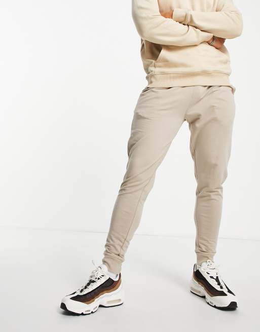 Joggers ajustados en beis de ASOS DESIGN