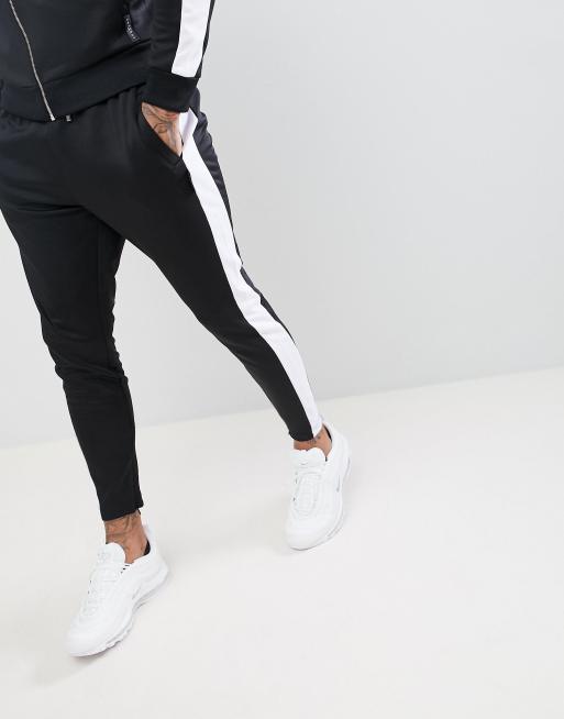 Joggers ajustados negros con rayas en los laterales de The Couture Club