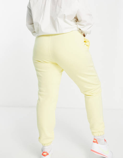 Joggers amarillos de corte pitillo con estampado universitario exclusivos de COLLUSION Pus, 2 de 4
