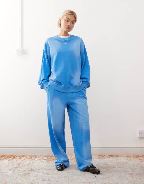 Joggers azul lavado holgados de talle bajo con parche del logo de COLLUSION (parte de un conjunto) - view 1