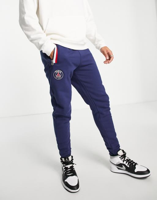 Joggers azul marino con detalles llamativos del Paris Saint-Germain de felpa de Jordan 