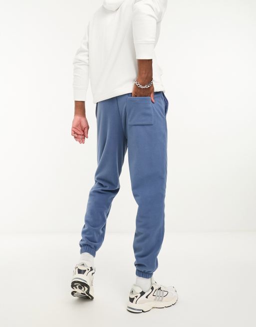 Joggers azul marino de corte tapered de felpa de ASOS DESIGN, 2 de 4