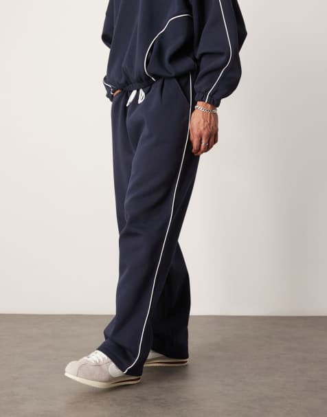 Joggers azul marino muy holgados con ribete lateral de ASOS DESIGN (parte de un conjunto) - view 1