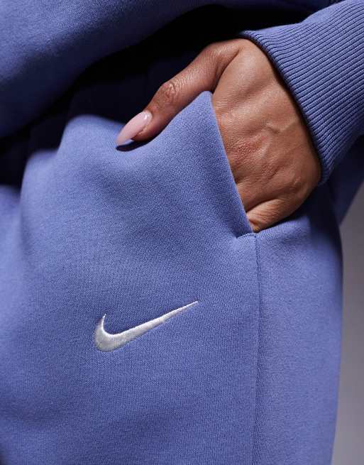 Joggers azules extragrandes de talle alto con bajos ajustados Phoenix Fleece de Nike, 4 de 5