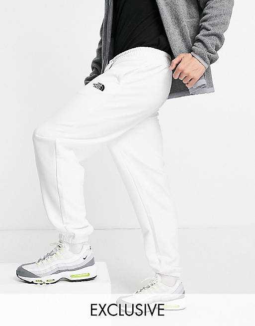 Hombre Pantalones y mallas | Joggers básicos extragrandes blancos exclusivos en ASOS de The North Face - BP36308