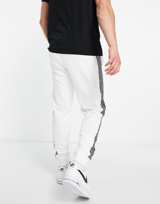 Pantalon nike banda lateral hot sale