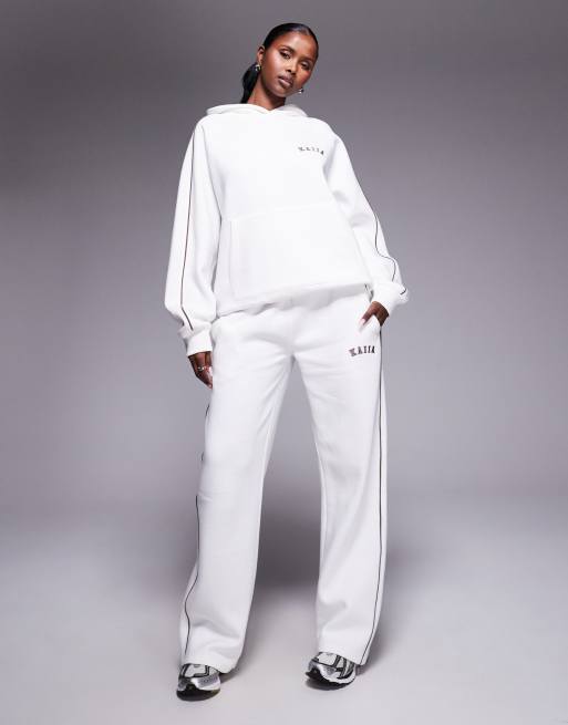 Joggers blancos de pernera ancha con raya lateral y logo bordado de Kaiia (parte de un conjunto)