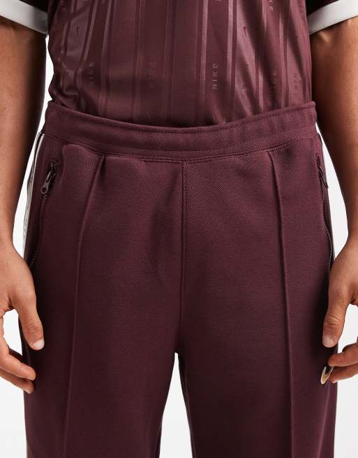 Joggers burdeos a rayas de corte tapered de Nike, 5 de 5
