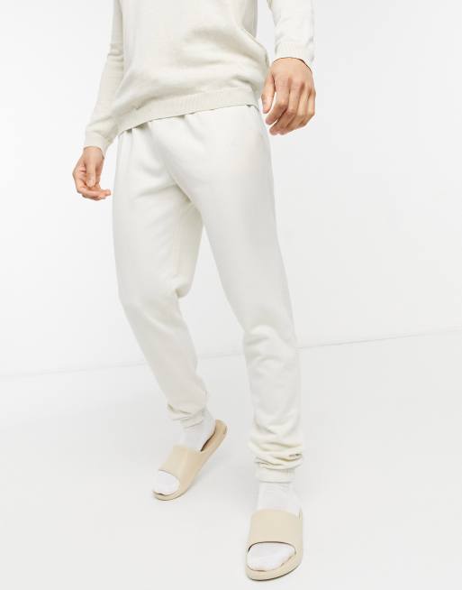Joggers color crema con bordado NLM de New Look