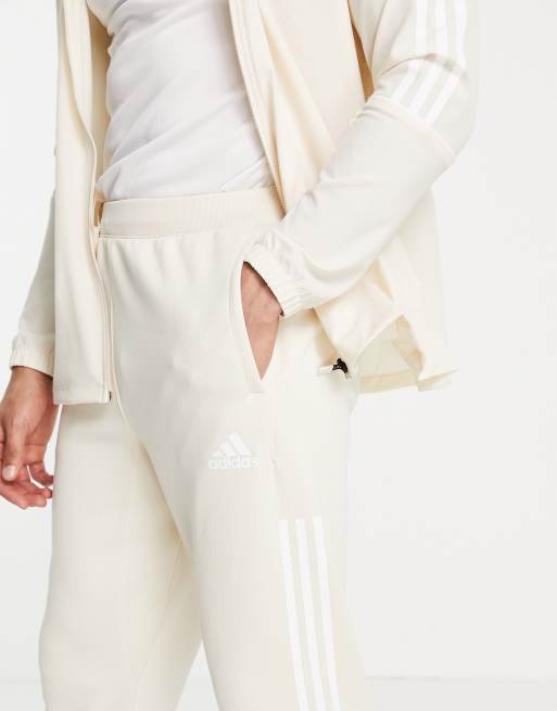 Joggers color crema con tres rayas blancas de adidas Training, 2 de 4