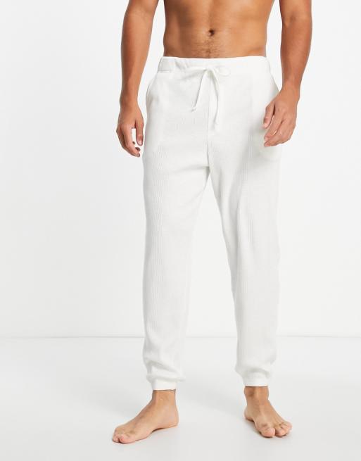 Joggers color crema de estar por casa de tejido acanalado de ASOS DESIGN