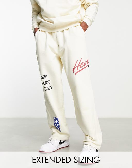 Joggers color crudo holgados con bajos fijos y estampados gráficos de ASOS Dark Future (parte de un conjunto)