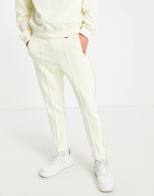 Joggers color leche de coco de corte tapered con detalle de cremallera Circa Pack de Nike