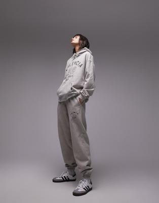 Joggers color piedra extragrandes con estampado gráfico 
