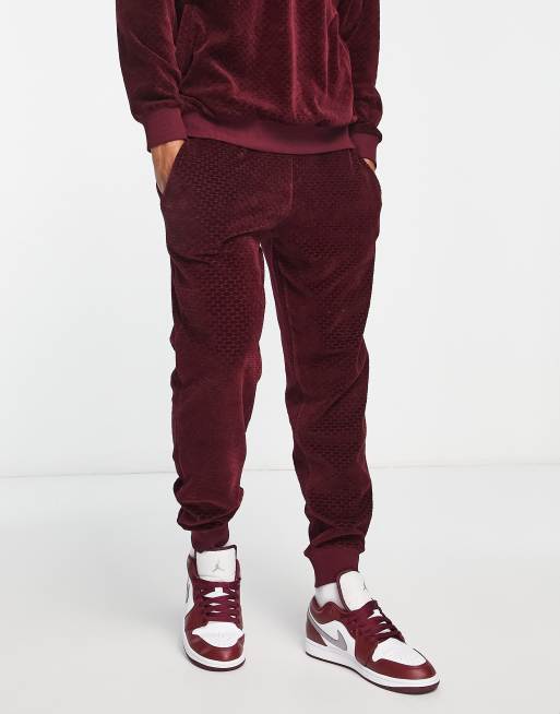 Joggers de corte tapered con diseño de jacquard de velour de ASOS DESIGN (parte de un conjunto)