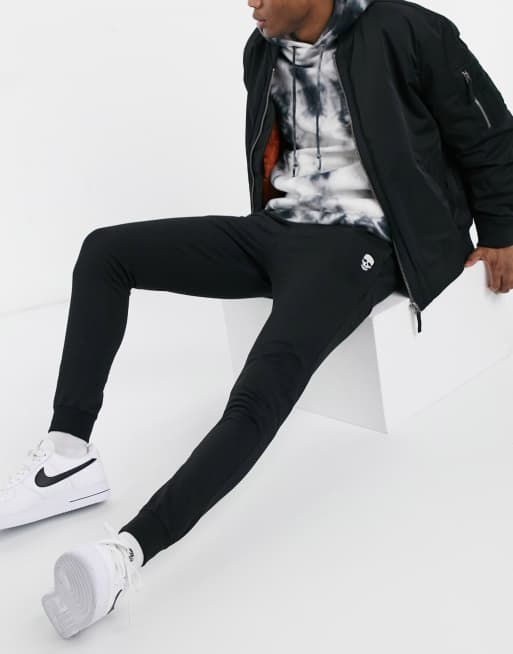 Joggers de estar por casa con bajos ajusrados y diseño de calavera de Bolongaro Trevor